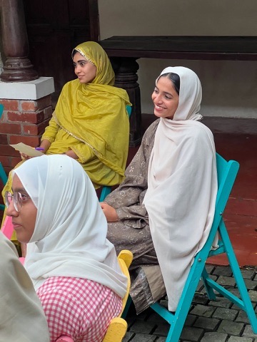 Kifayat members sharing a moment during a community gathering